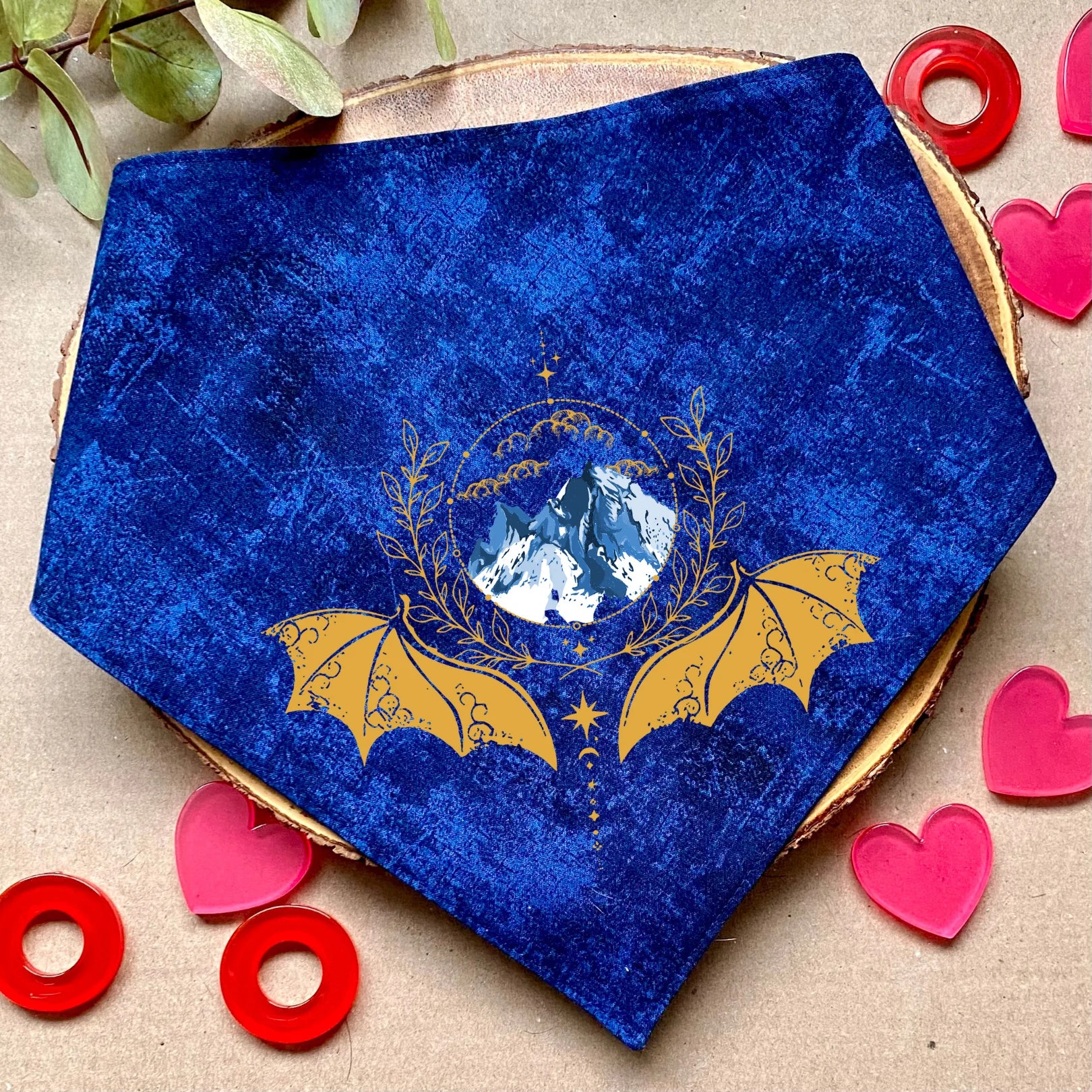 Clip-on dog bandana inspired by fantasy, romantic, and romance books – easy to wear and perfect for book-loving pet owners who want to add a touch of literary charm to their dog’s style.